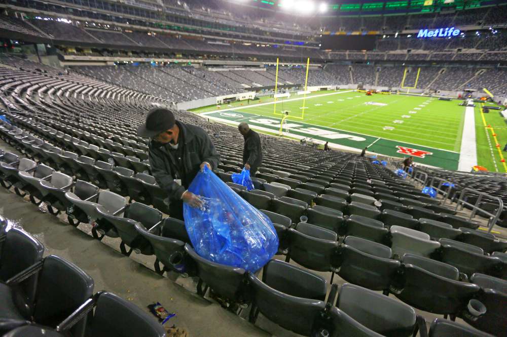 Manuel Tajada cleaning up early Monday after Sunday's Jets game.